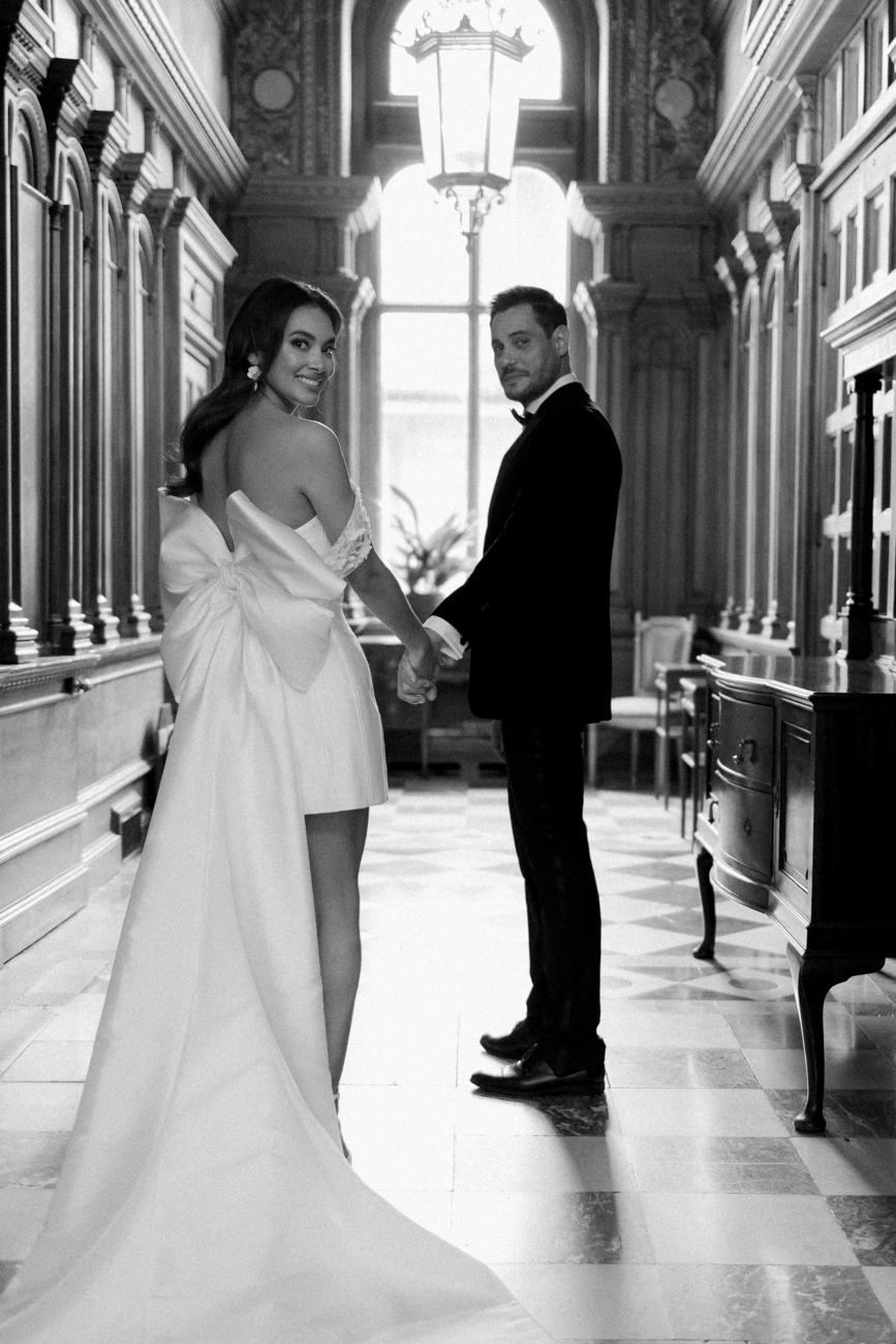 bride and groom looking back over the shoulder at The Ned wedding