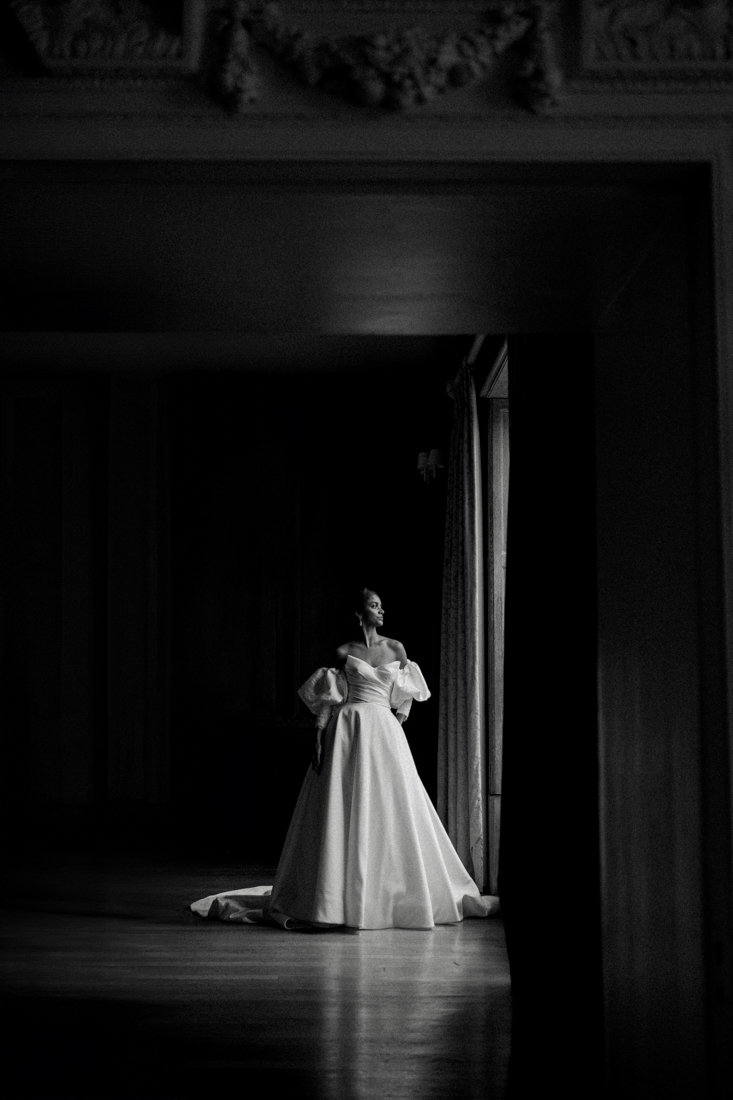 bride standing by window at findon place
